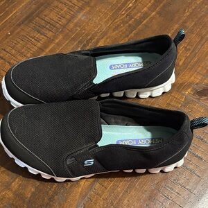 Skechers Women's Black and White Slip-On Sneakers